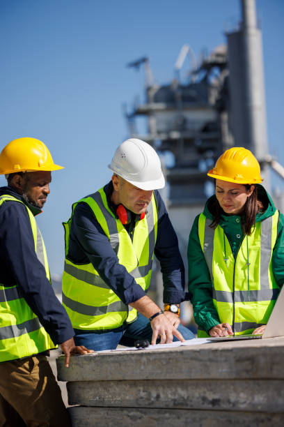Engineers discussing at industrial facility